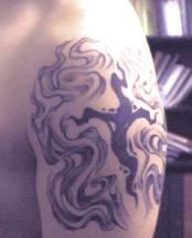 Small cross tattoo