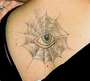 eye on the spider web tattoo on the upper back.JPG