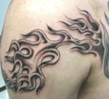 Image of Big black ink fire tattoo.JPG