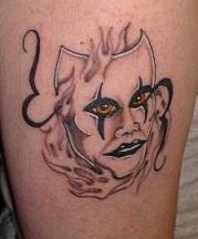 mask tattoo picture with fire patterns.JPG
