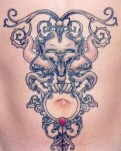 Stomach tattoo with devil cat.JPG