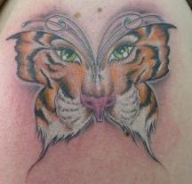 Tiger face in butterfly tattoo.JPG