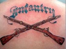 Guns tattoo on the back.JPG