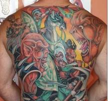Colorful back tattoo with evil faces.JPG