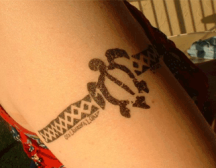 Hawaii arm ring tattoo with a turtle image.PNG