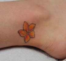 Tropical flower ankle tattoo in orange.PNG