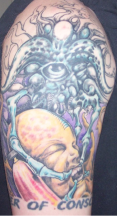 Alien ink tattoo on the arm.PNG