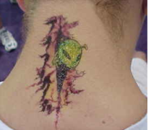 Cute alien tattoo on the upper neck.PNG