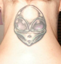 Image of alien face tattoo on the back neck.PNG