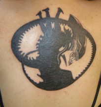 Picture of alien tattoo on the up back.PNG