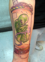 Pictures of alien ink tattoos on the leg.PNG