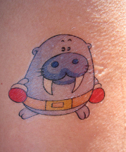 Purple boxing walrus tattoo.PNG
