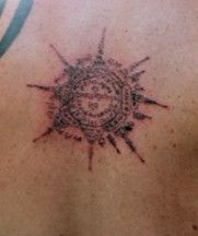 Image of buddhist wheel tattoo.PNG