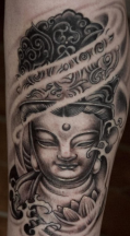 Tribal Buddhist Tattoo with flowers.PNG