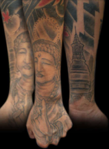 Buddhist Tattoo on arms and legs.PNG