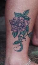 Purple rose tattoo