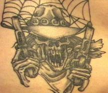 skull with guns tattoo