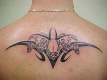 skulls tattoo on the back