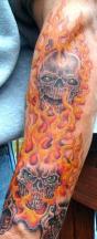 two skull on fire tattoo