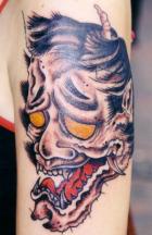 devil tattoo with black hair