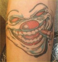 evil clown tattoo with cigar