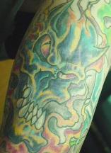 green evil skull tattoo
