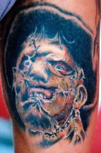 scarred face tattoo