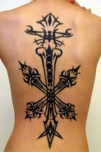 back and lower back cross tattoo.jpg