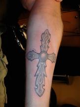 Forearm cross tattoo.jpg