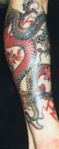 Green and red dragon tattoo