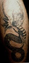 Black dragon with wings tattoo