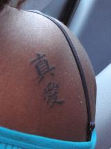 upper back tattoo with chinese characters.jpg