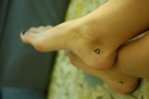 small hearts feet tattoos.jpg