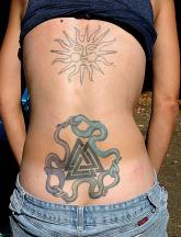 sun tattoo design on upper back.jpg