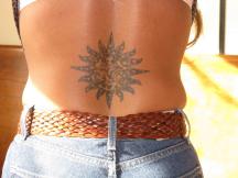 sun tattoo on the lower back.jpg
