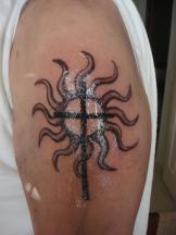 sun tattoo with cross.jpg