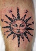 sunface tattoo.jpg