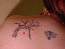 Tree with red sun tattoo.jpg