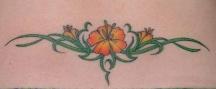 orange tattoo with thin leaves tattoo