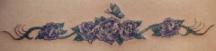 purple flowers tattoo