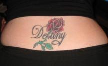 Red rose with leaves and name tattoo