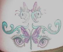 pink butterfly with cat eyes tattoo photo