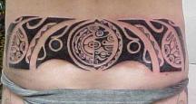 Tribal lower back tattoo.jpg