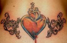 big heart tattoo in orange on the lower back
