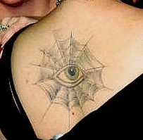 eye tattoo on the upper back.jpg
