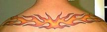 fire tattoo in the upper back.jpg