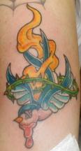 Bird on fire tattoo