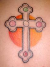 Colorful cross tattoo
