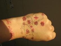 Small Red flowers wrist tattoos pics.JPG