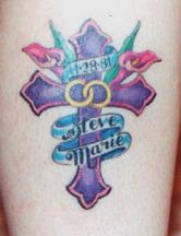 Purple cross with flowers tattoo